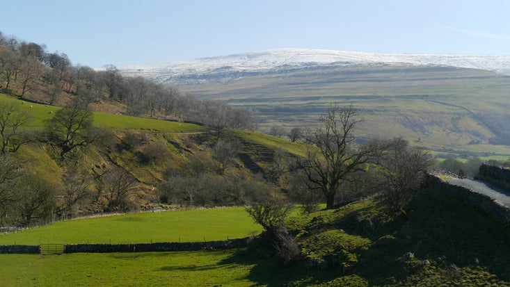 A bright spring day view of Buckden Pike